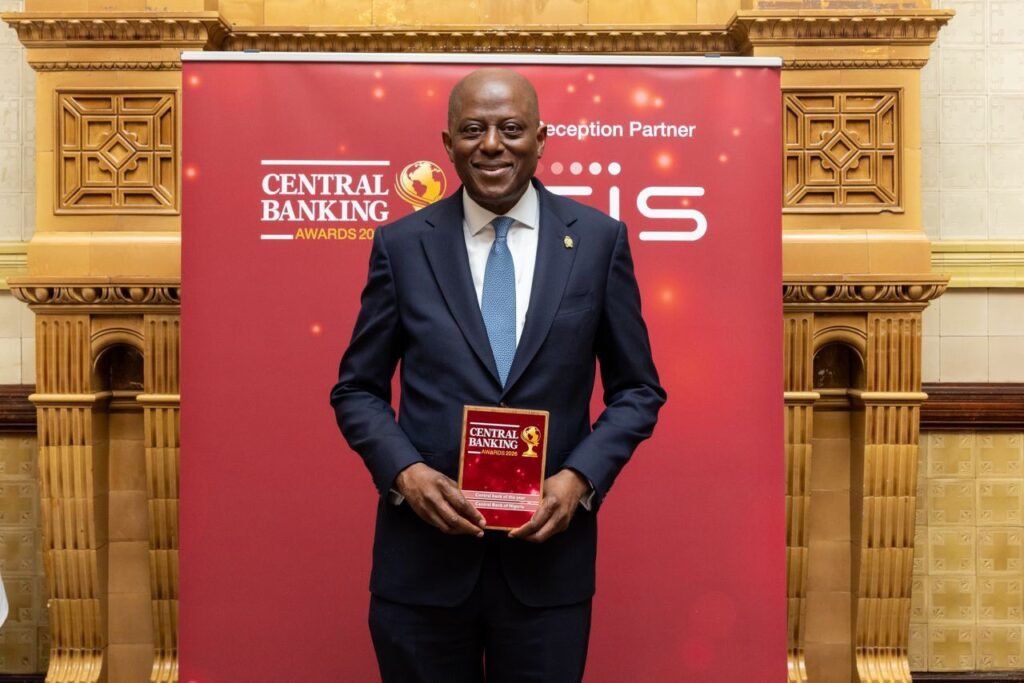 governor Cardoso standing with the award